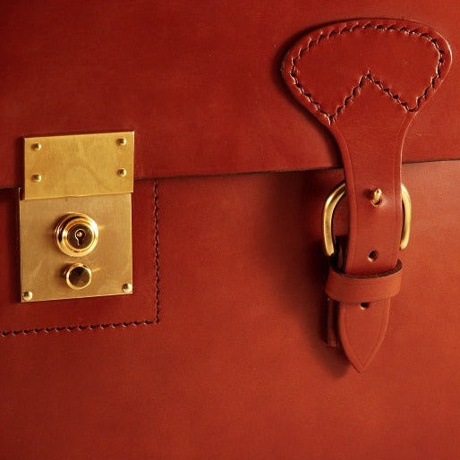 Gavin: Bespoke Triple Gusset Flap Over with Short Straps with Self Lining, Single Position Brass Lock and Top Attached adjustable shoulder Strap | Hand Stitched | Black English Bridle Leather | Hand Made in England