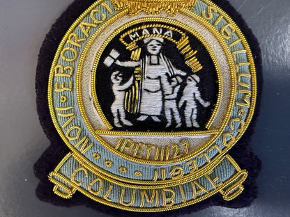 Custom Columbia University Embroidered patch with classical design and text on a dark background